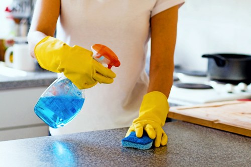 Stain treatment on a sofa during upholstery cleaning